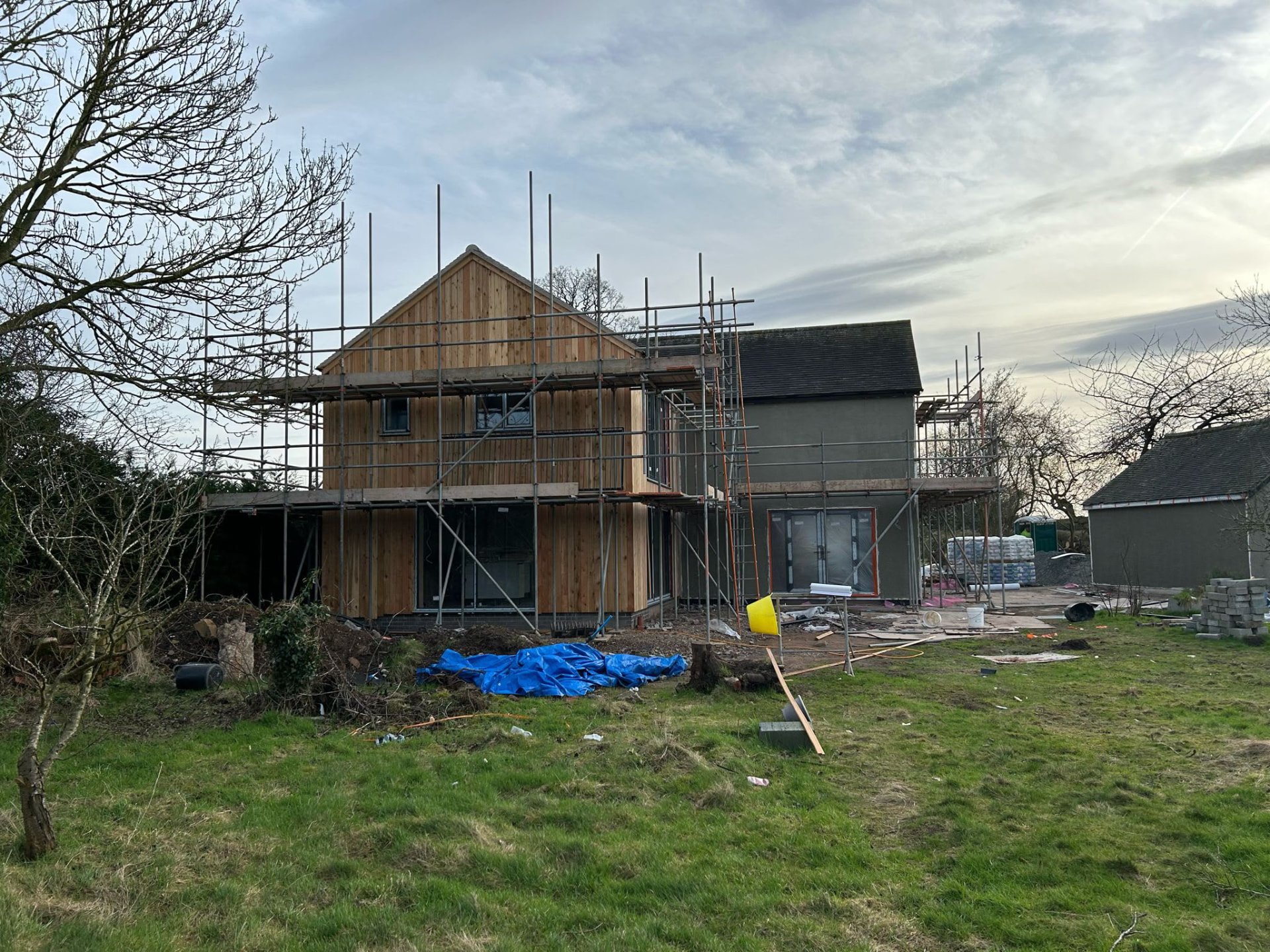 Vertical timber cladding on the completed extension gable