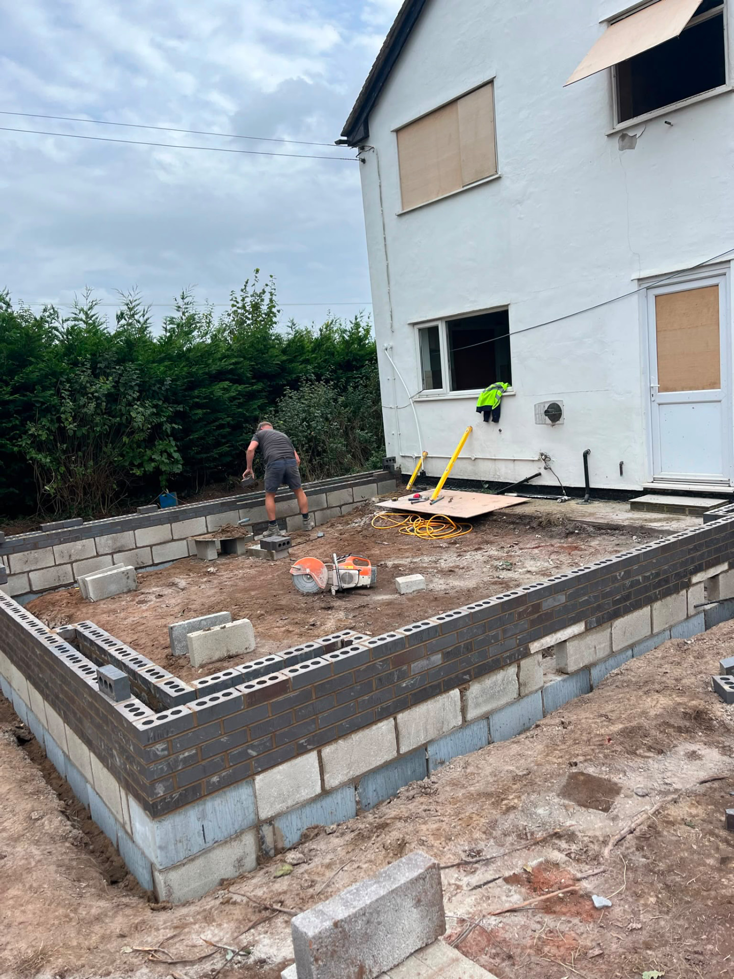 Brick and block footings set out for the double storey rear extension