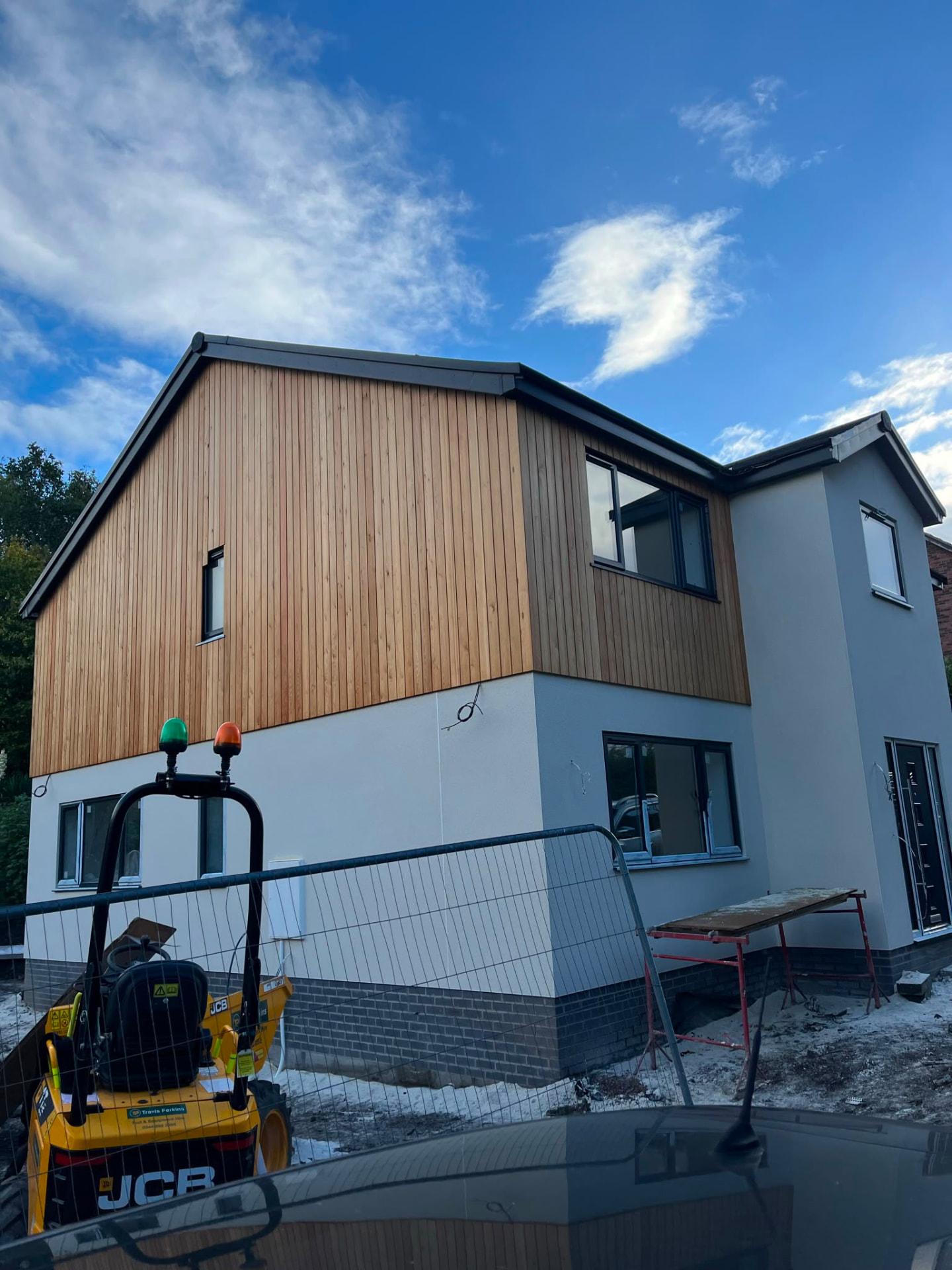 Cedar cladding and render complete on Ashwood House during the final build stage